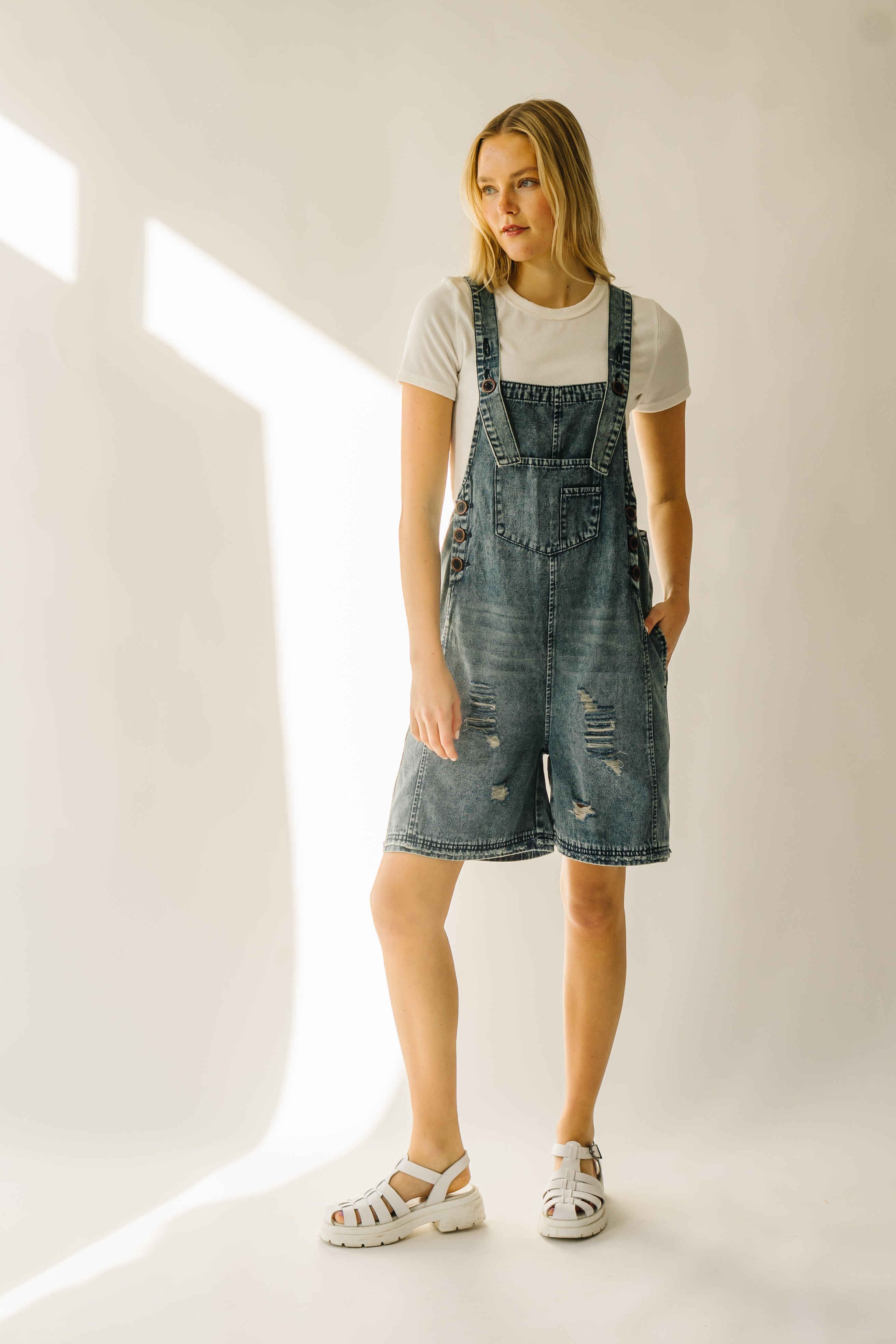 The Dearing Washed Denim Shorts Romper in Vintage Denim