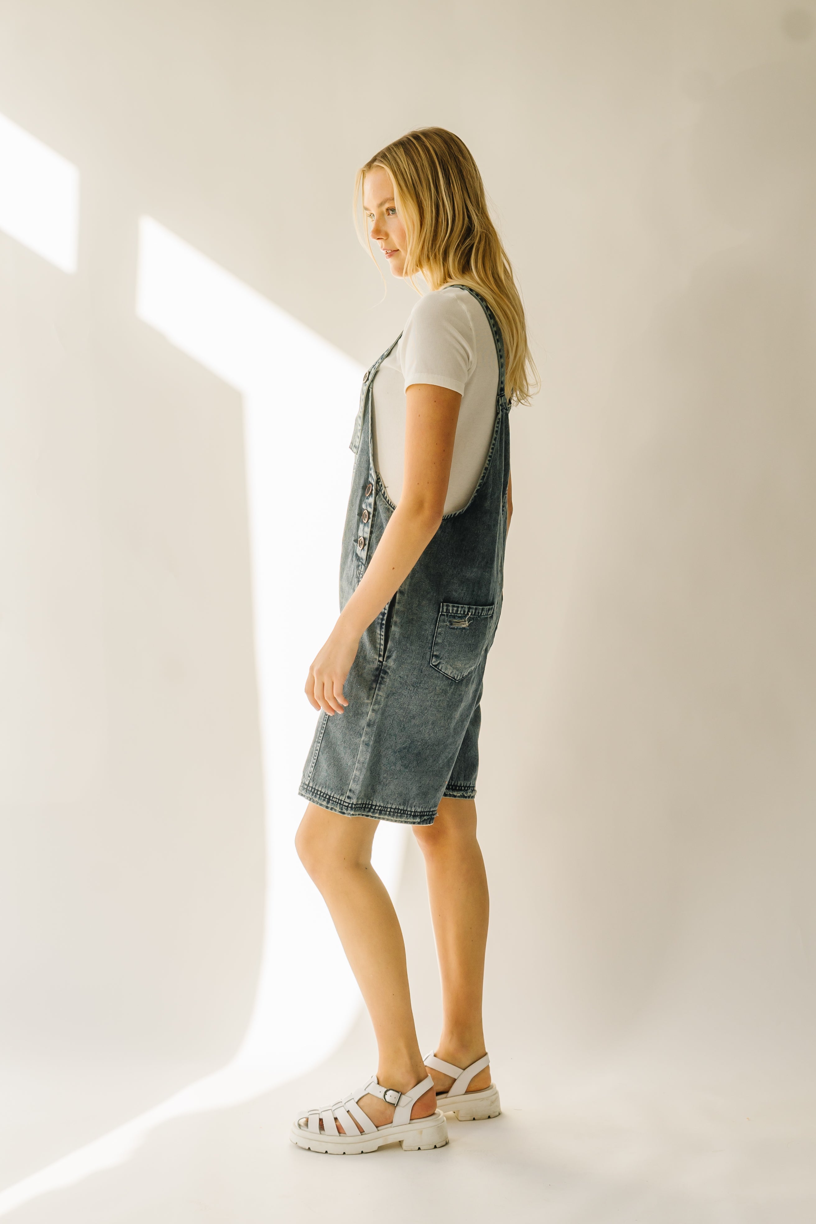 The Dearing Washed Denim Shorts Romper in Vintage Denim